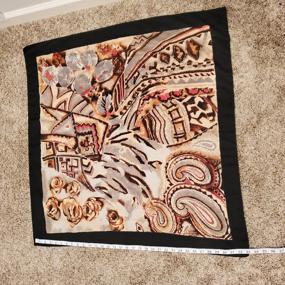 scarf with a black outline and a multi-colored abstract floral and paisley